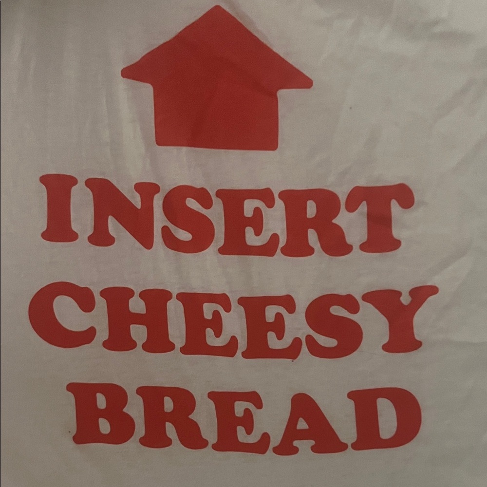 insert cheesy bread to mouth tee
